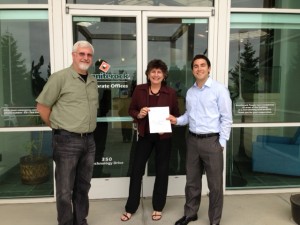 Andrew O’Such of Enterprise Fleet Management delivers a donation check for Pajaro Valley Shelter Services to Ken Schipper and  Rose Ann Woolpert of Graniterock